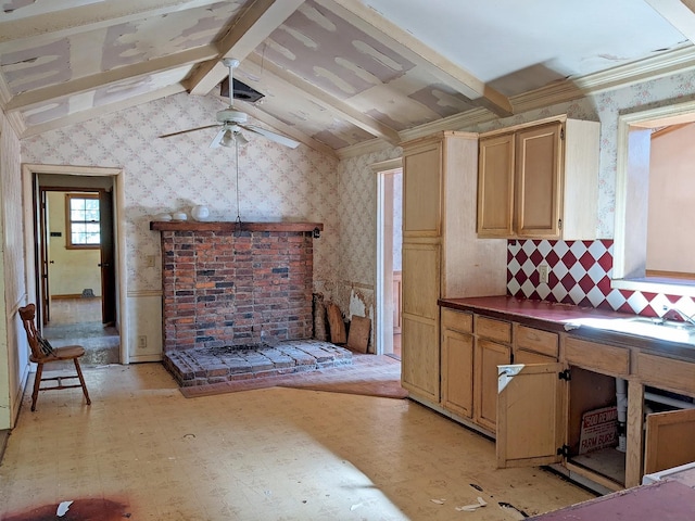 kitchen with ceiling fan, ornamental molding, and lofted ceiling with beams