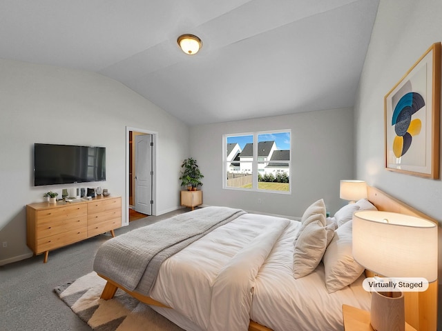 carpeted bedroom with lofted ceiling