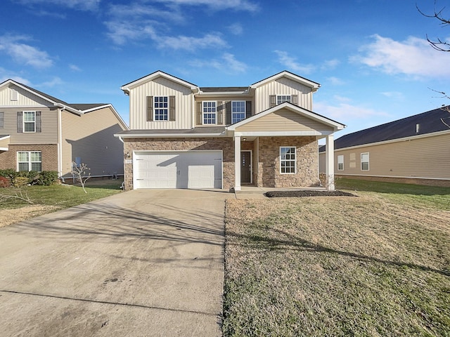 view of front of house with a garage, a front yard, and covered porch