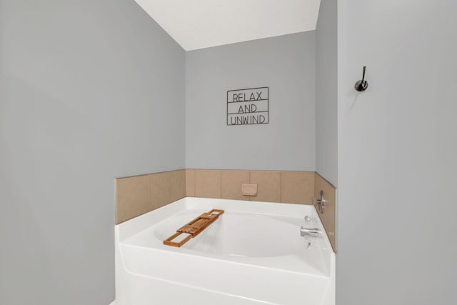 bathroom featuring a tub