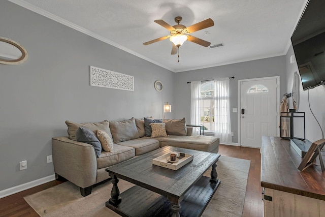 living room with hardwood / wood-style floors and ornamental molding