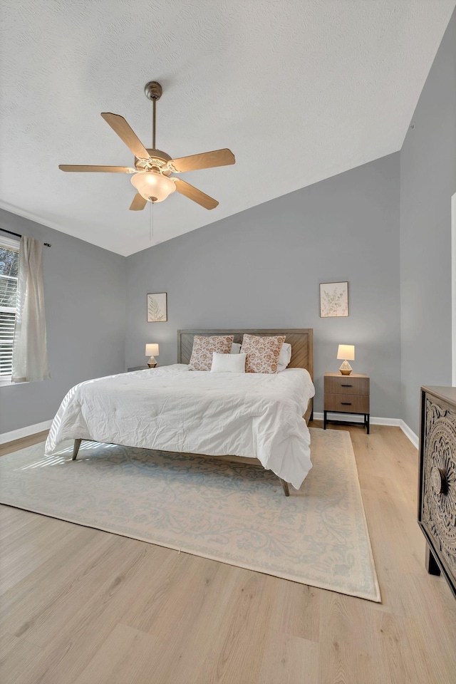 bedroom featuring light wood-type flooring and ceiling fan