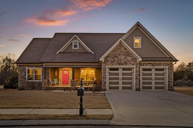 craftsman-style home featuring a garage and covered porch