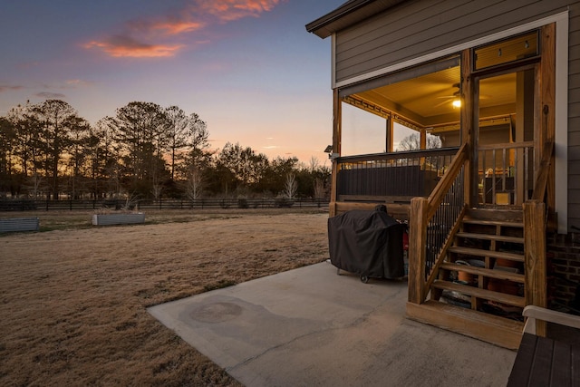 yard at dusk with a patio