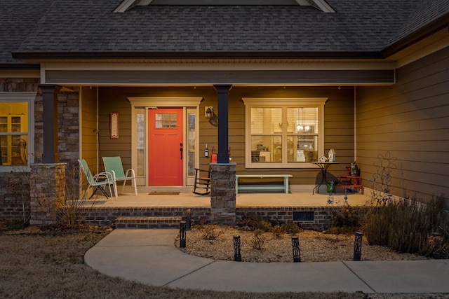 entrance to property featuring a porch