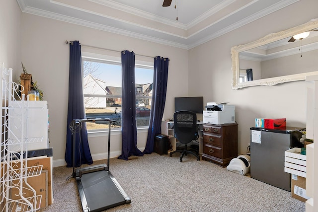 home office with carpet floors, a raised ceiling, ceiling fan, and ornamental molding