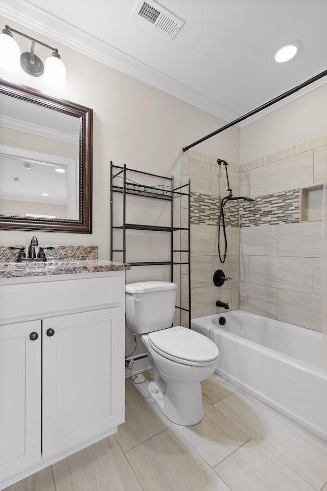 full bathroom with tiled shower / bath combo, tile patterned flooring, vanity, toilet, and ornamental molding