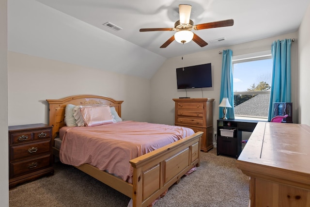 carpeted bedroom featuring ceiling fan and vaulted ceiling