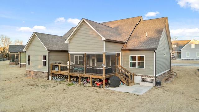 rear view of house with a sunroom