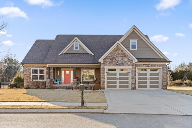 craftsman-style home featuring a porch and a garage