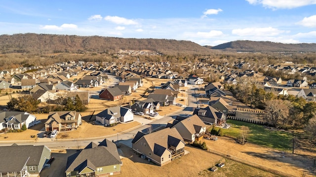 birds eye view of property with a mountain view