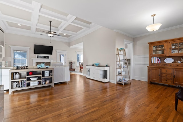 living room featuring coffered ceiling, plenty of natural light, dark hardwood / wood-style floors, and beam ceiling