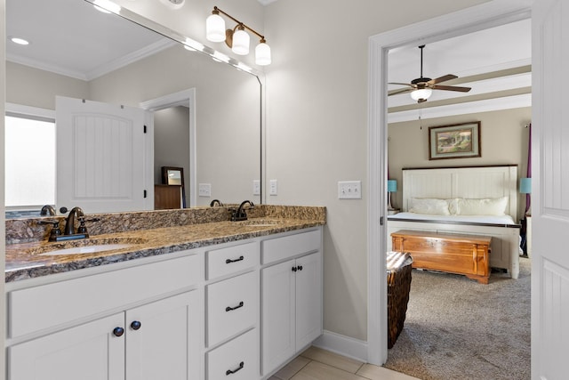 bathroom with ceiling fan, vanity, and ornamental molding