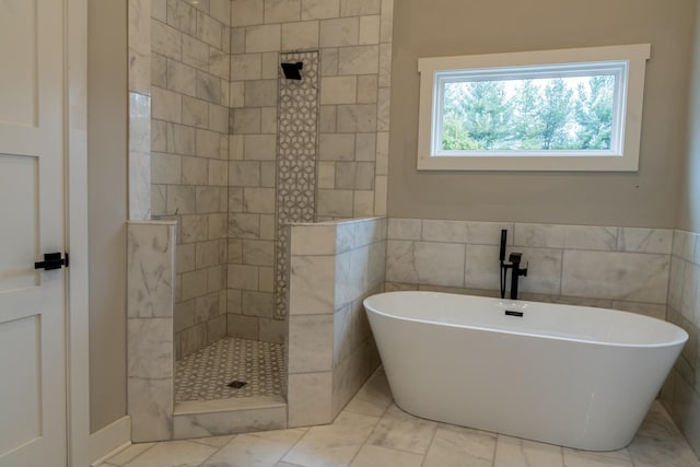 bathroom with separate shower and tub