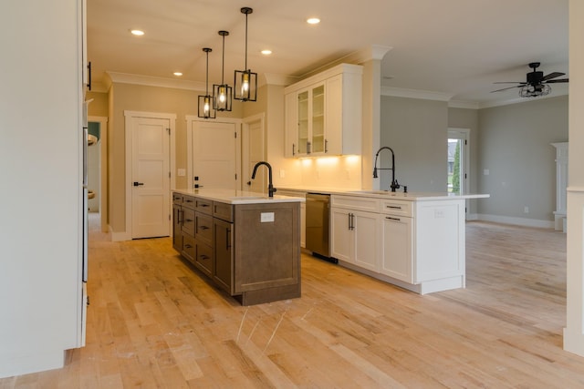 kitchen with sink, white cabinetry, a center island with sink, and stainless steel dishwasher