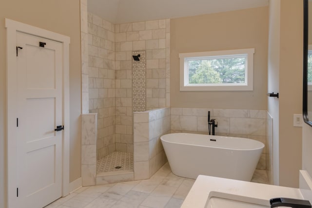 bathroom featuring independent shower and bath and vanity