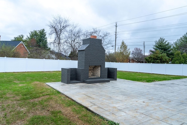 view of patio / terrace featuring an outdoor brick fireplace