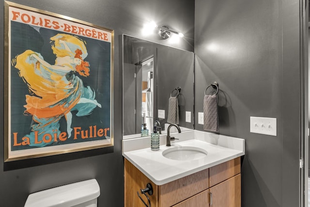 bathroom with toilet and vanity