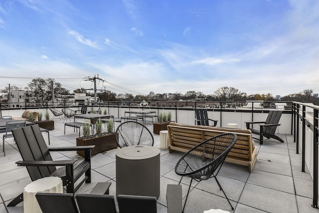 view of patio / terrace with a balcony and outdoor lounge area