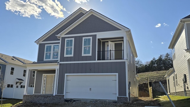 craftsman house featuring an attached garage and board and batten siding