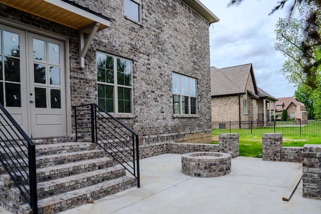 view of patio / terrace featuring an outdoor fire pit