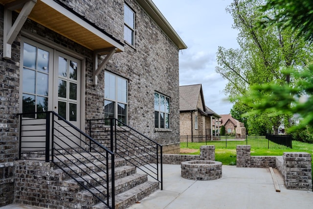 view of patio / terrace featuring an outdoor fire pit