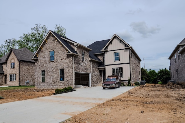 craftsman-style home with a garage and cooling unit