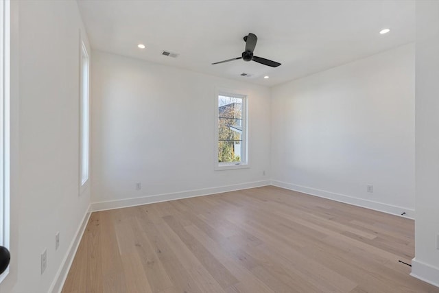 empty room featuring ceiling fan and light hardwood / wood-style floors