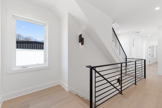 staircase featuring hardwood / wood-style floors