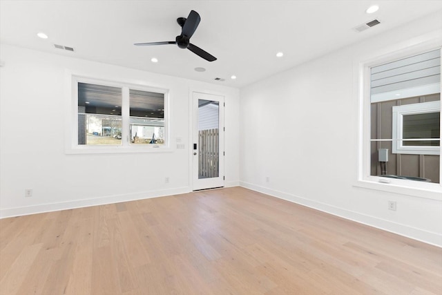 spare room with ceiling fan and light hardwood / wood-style flooring