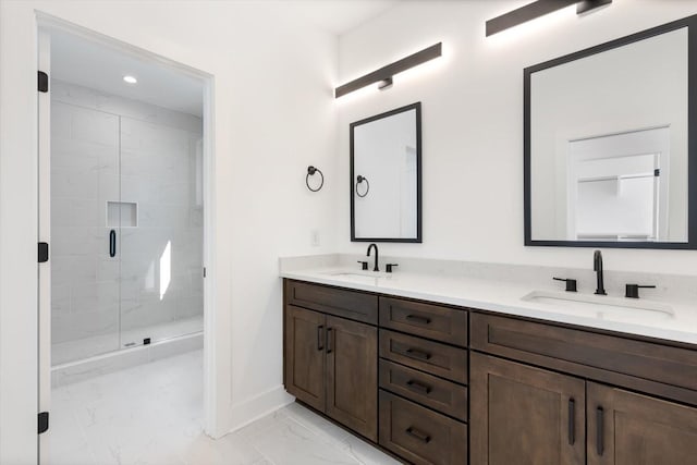 bathroom featuring walk in shower and vanity