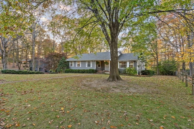 ranch-style home featuring a front yard