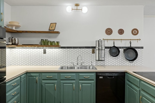 kitchen featuring sink, backsplash, green cabinets, and black appliances