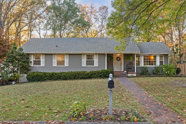 ranch-style house with a front yard