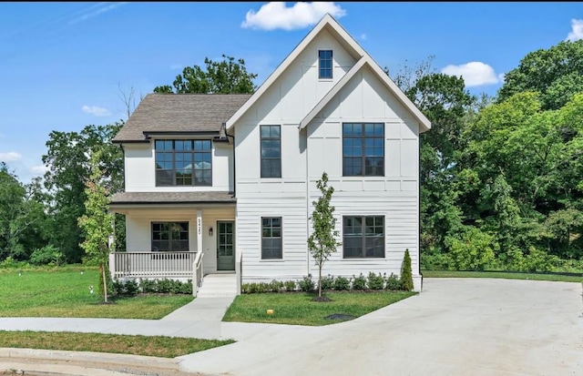 view of front of house featuring a porch and a front lawn