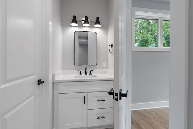 bathroom featuring hardwood / wood-style floors and vanity