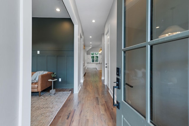 corridor featuring hardwood / wood-style floors