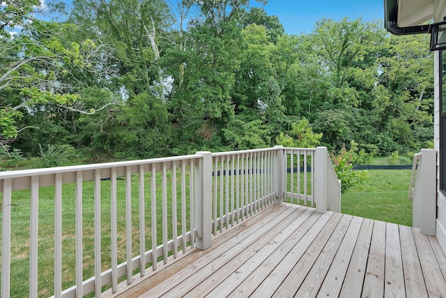 wooden terrace with a yard