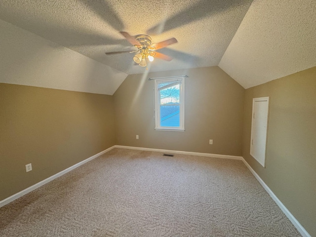 bonus room featuring visible vents, baseboards, lofted ceiling, and a ceiling fan