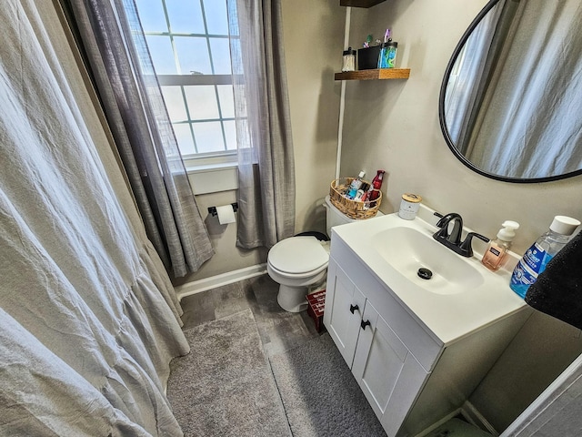 bathroom with hardwood / wood-style floors, toilet, and vanity