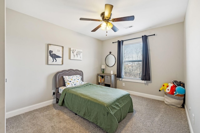 bedroom featuring light colored carpet and ceiling fan