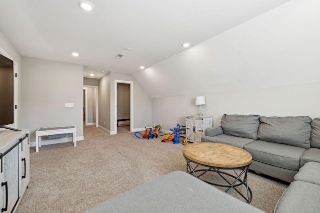 carpeted living room featuring vaulted ceiling