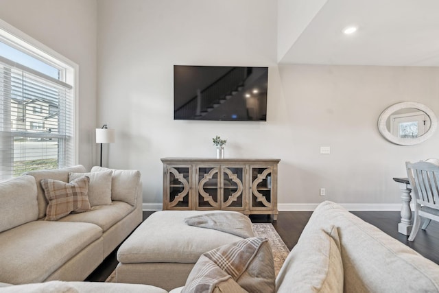 living room with dark hardwood / wood-style flooring