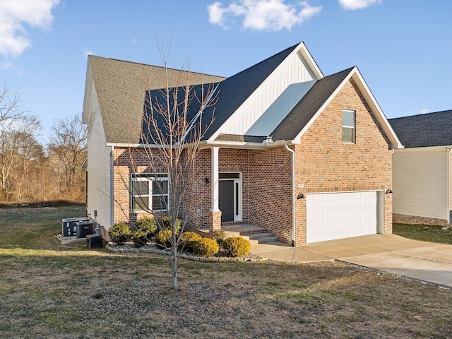 view of front of house featuring central AC unit and a garage