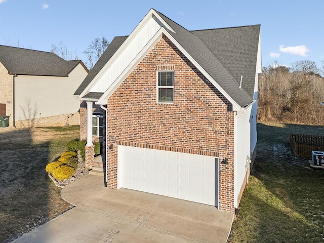 view of property exterior featuring a garage and a yard