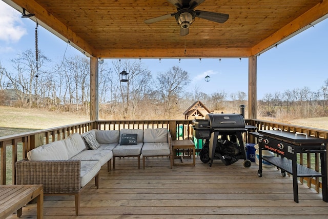 deck with area for grilling, outdoor lounge area, and ceiling fan