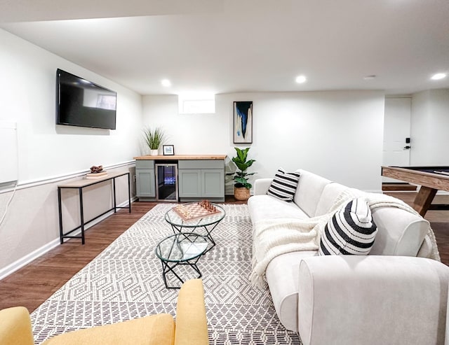 living room featuring dark hardwood / wood-style floors and wine cooler