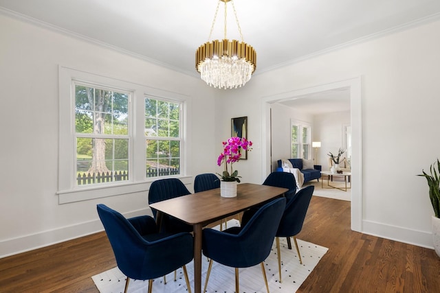 dining room featuring a notable chandelier, crown molding, and dark hardwood / wood-style floors