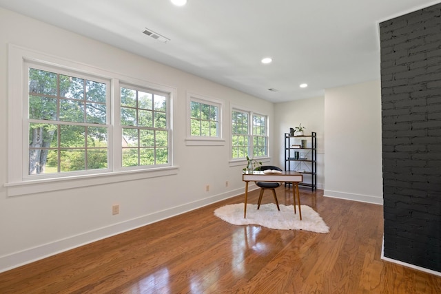 office area with hardwood / wood-style flooring and plenty of natural light