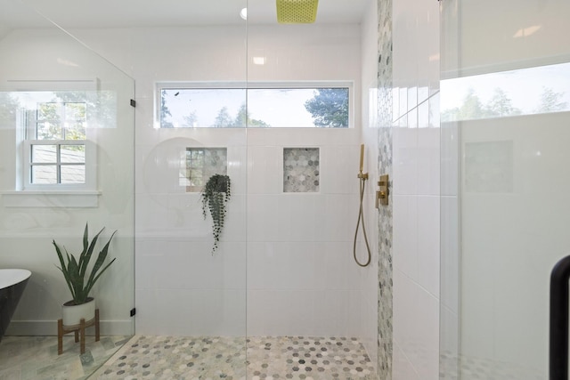 bathroom with tiled shower